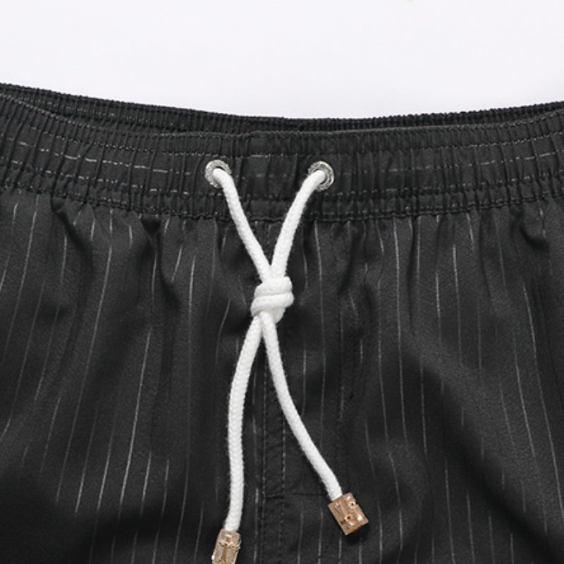 Schnelltrocknende gestreifte Strandshorts